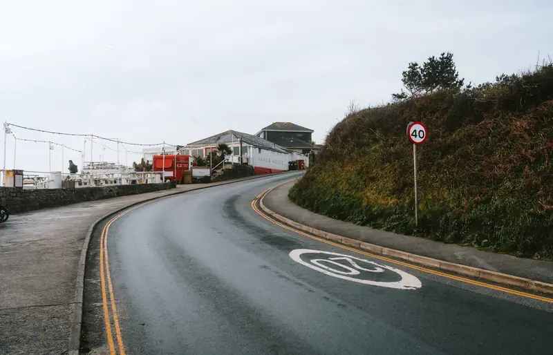 Road winding down towards Swanpool