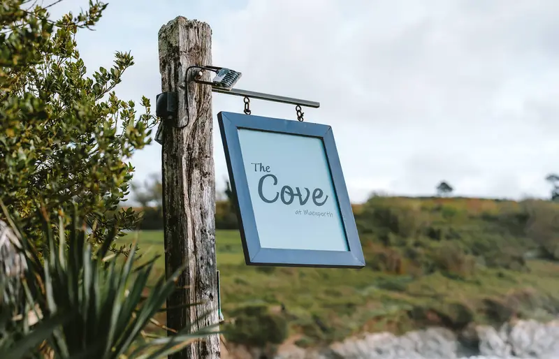 Hanging sign for The Cove at Maenporth