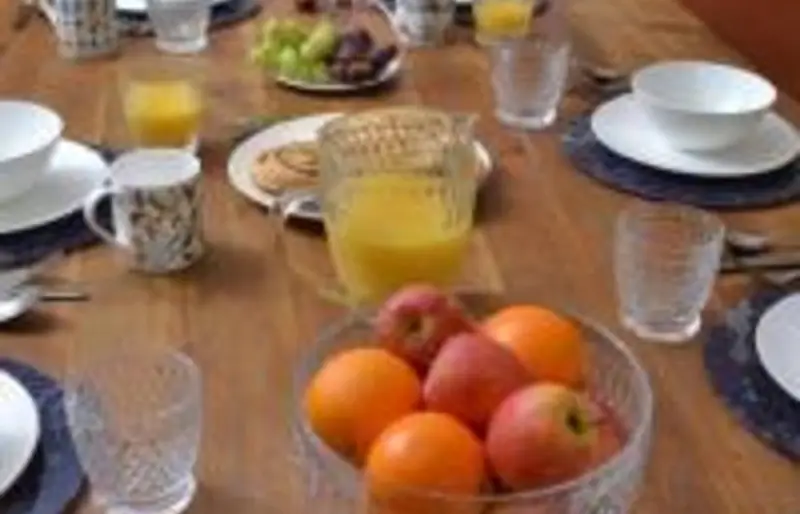Breakfast table with fruit and juice