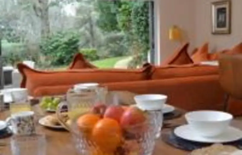 Dining table by the garden doors set for breakfast