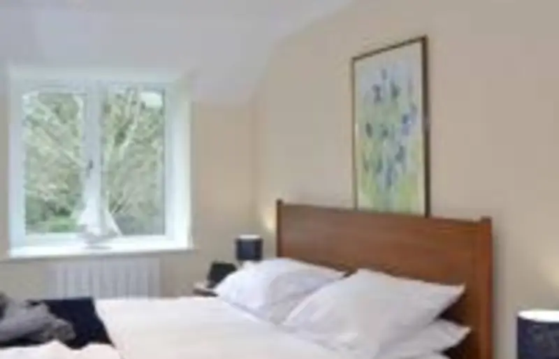 Double bedroom with wooden headboard