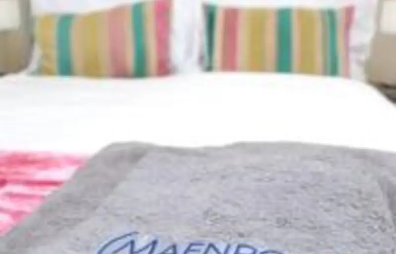 Maenporth towels on the bed
