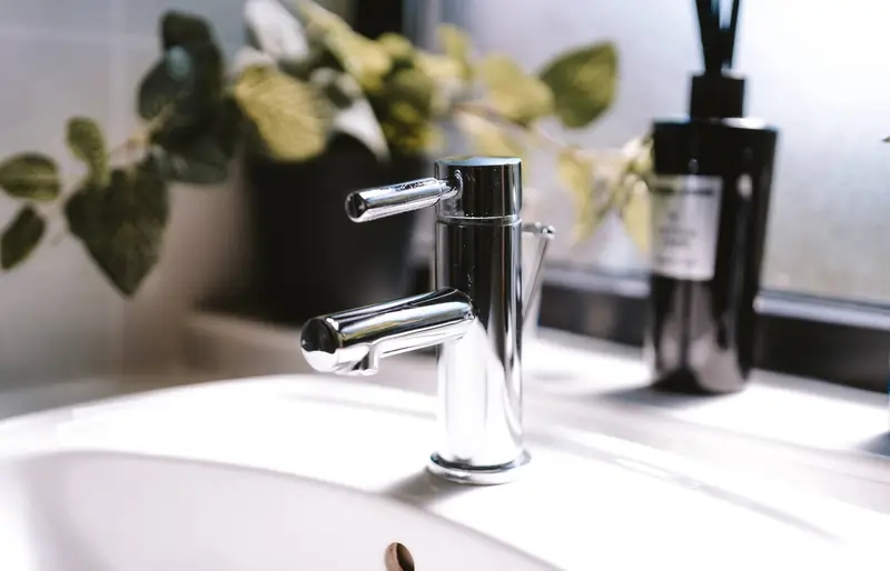 Bathroom basin with chrome tap