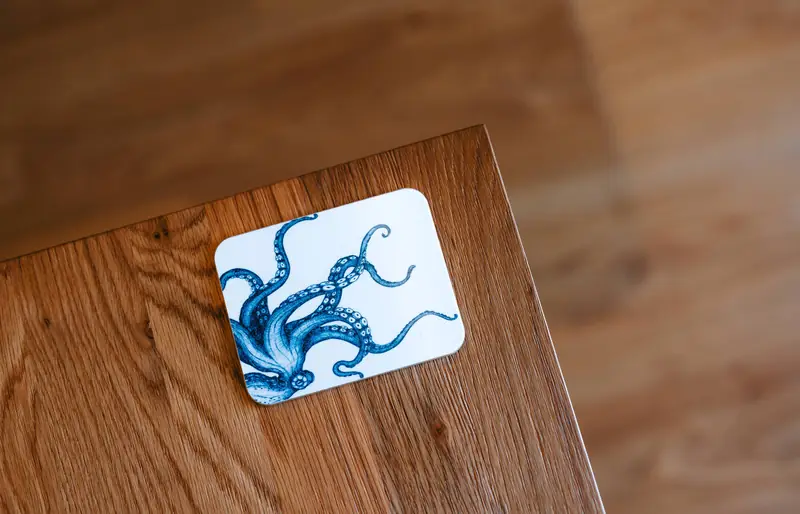 Octopus coaster on the wooden table