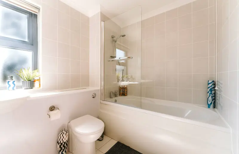 Main bathroom with bath and shower
