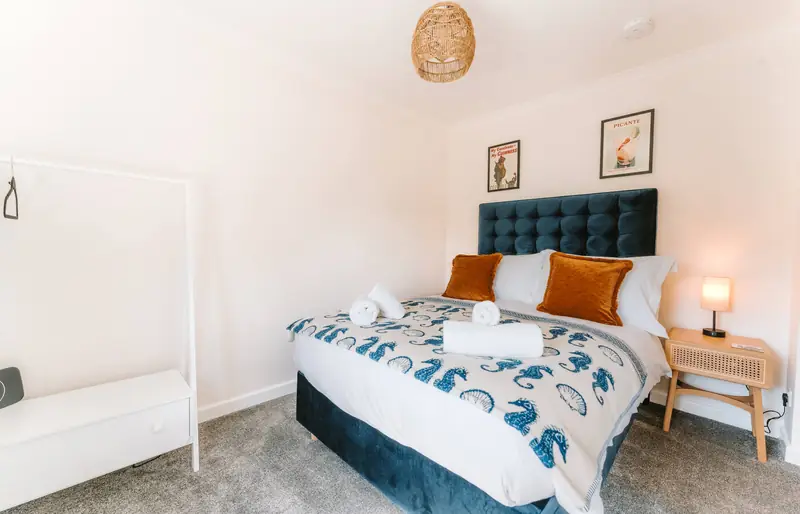 Second bedroom with navy headboard